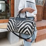 sac de voyage tendance en cuir imprimé