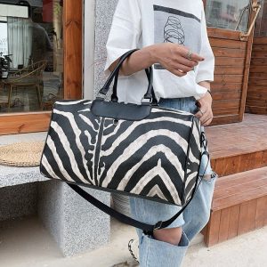 sac de voyage tendance en cuir imprimé
